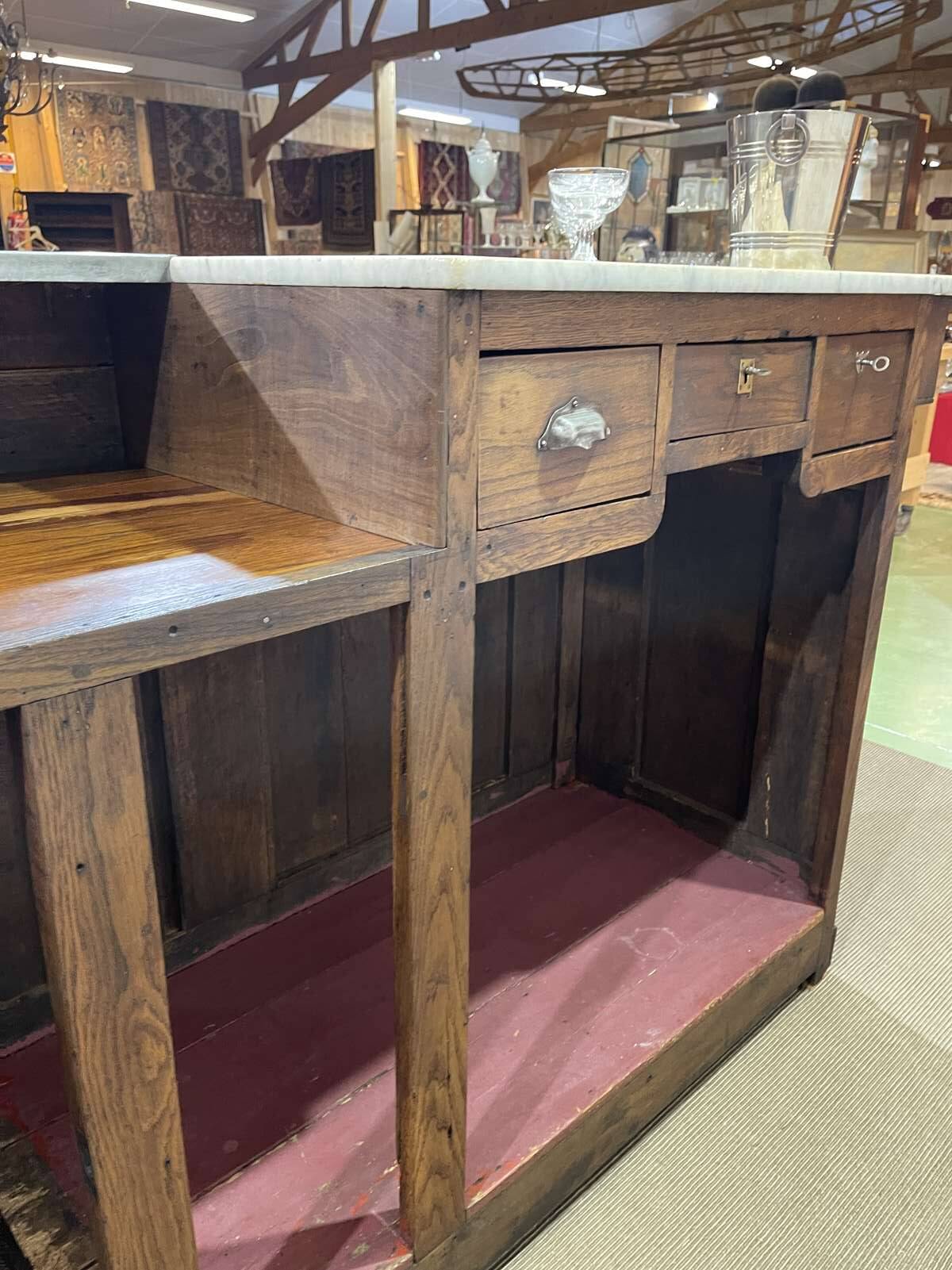 Bar counter in oak, zinc, and white marble from the early 20th century.