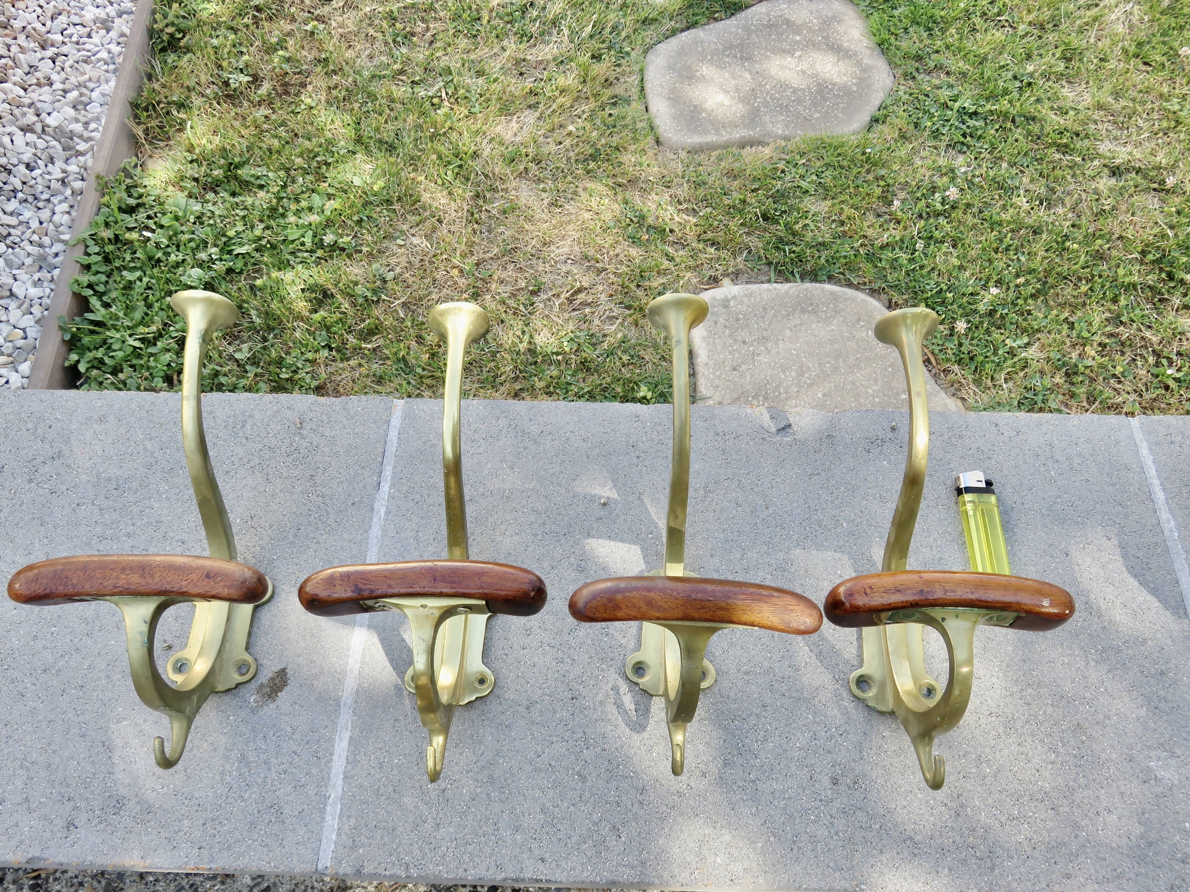 Pair of Art Nouveau coat hooks in bronze and chestnut, circa 1930.