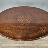 Coffee table in walnut with maple inlays and wheels