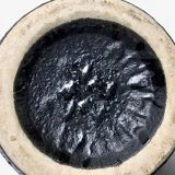 "Fat Lava" vase black background and colorful enamelled drippings