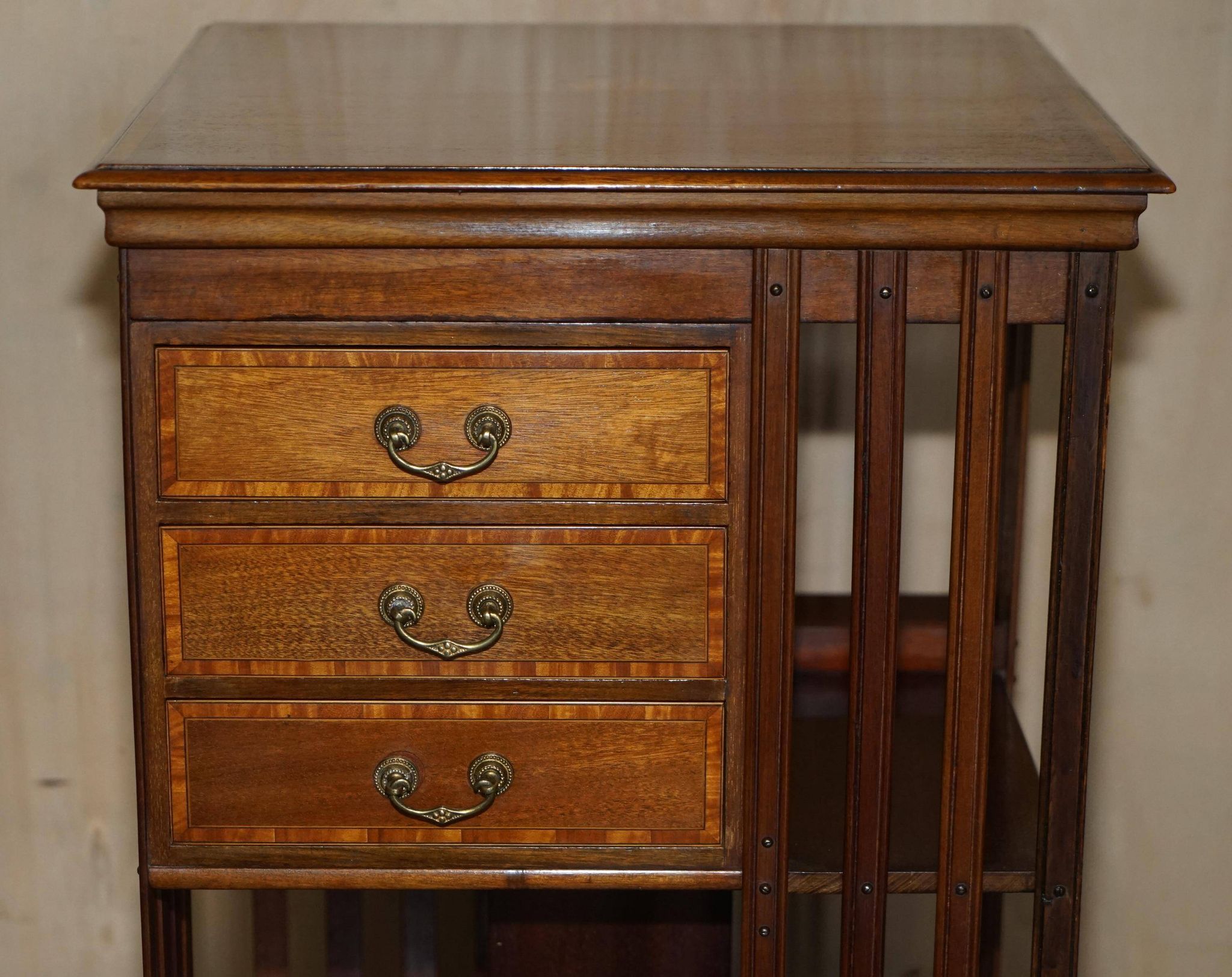Restored Victorian walnut revolving library.
