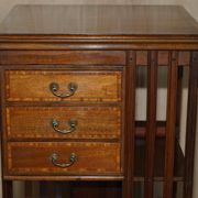 Restored Victorian walnut revolving library.