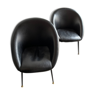 Pair of black skai armchairs from the 50s