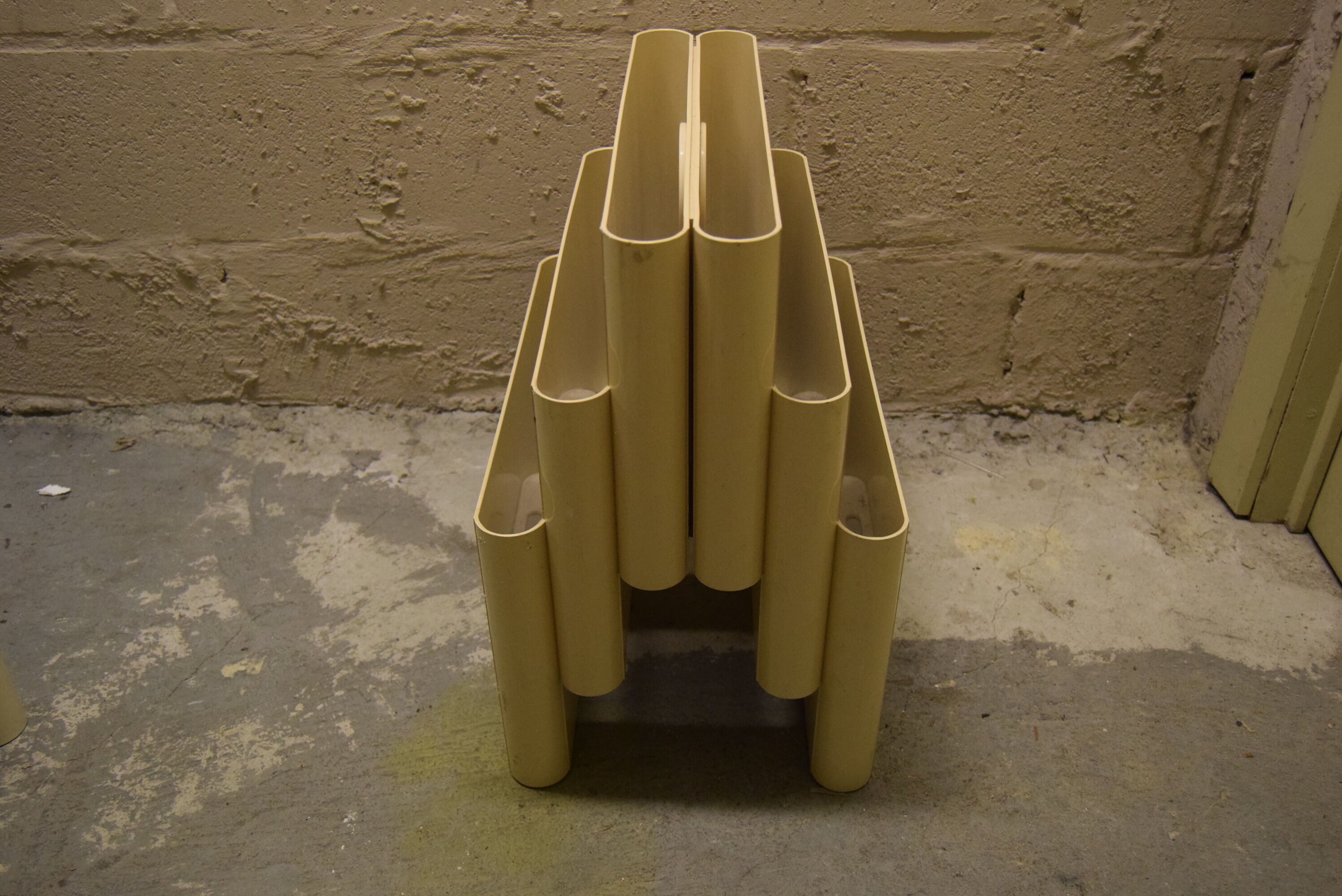 Kartell magazine holder by Giotto Stoppino