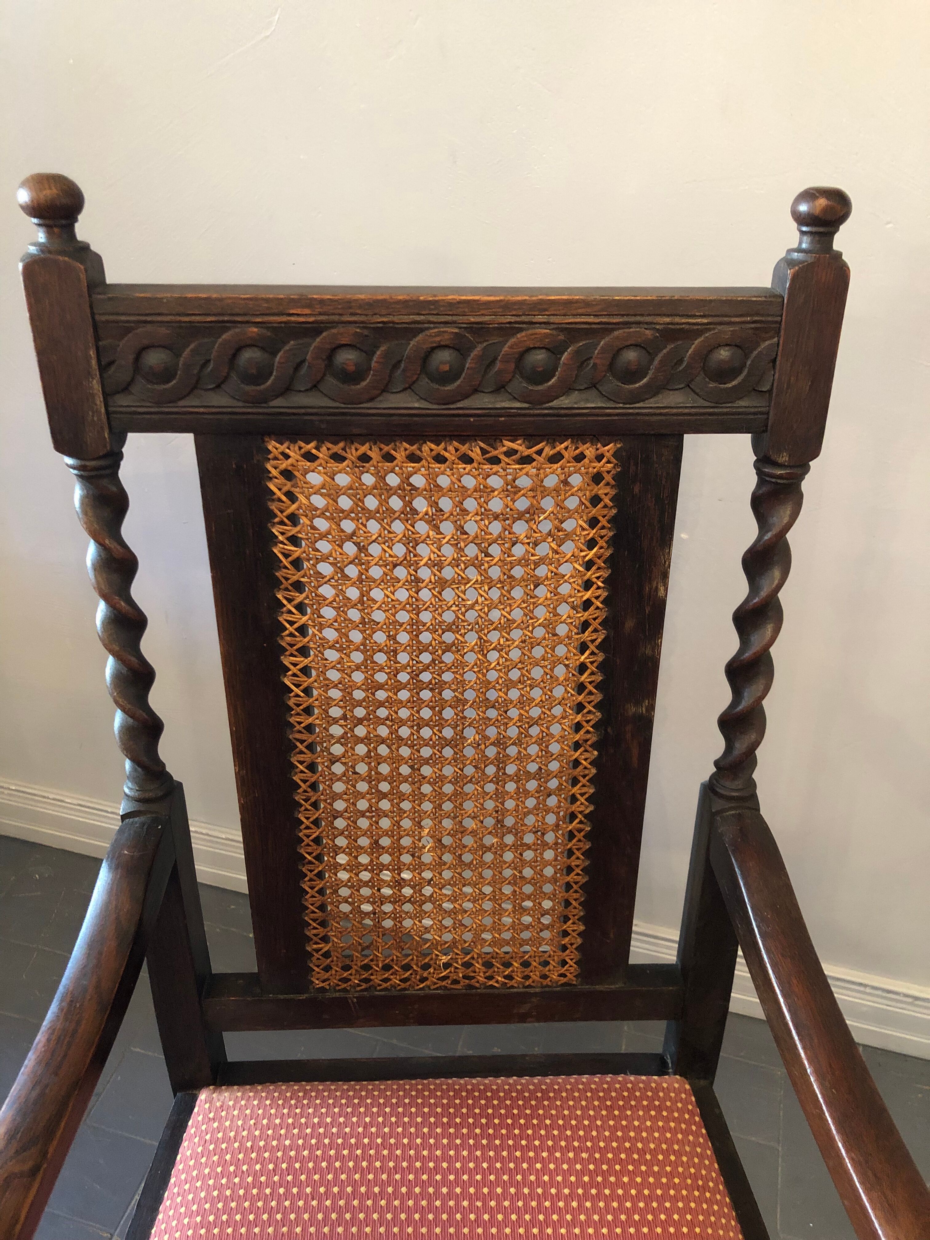 Carved wooden armchair and cannage