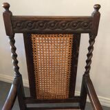 Carved wooden armchair and cannage