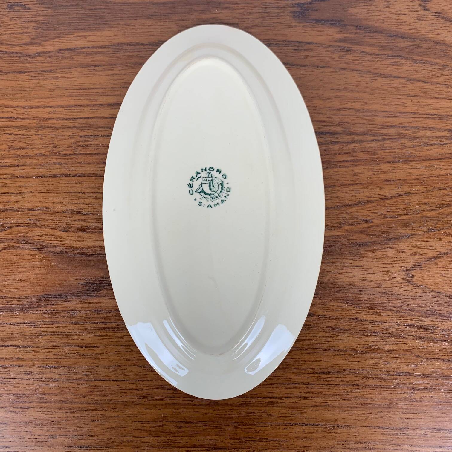 Small St Amand Ceranor dish, dark green flower pattern