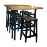 standing oak table and its 6 stools