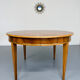 Round walnut Napoleon III extendable table with bronze top in good condition.