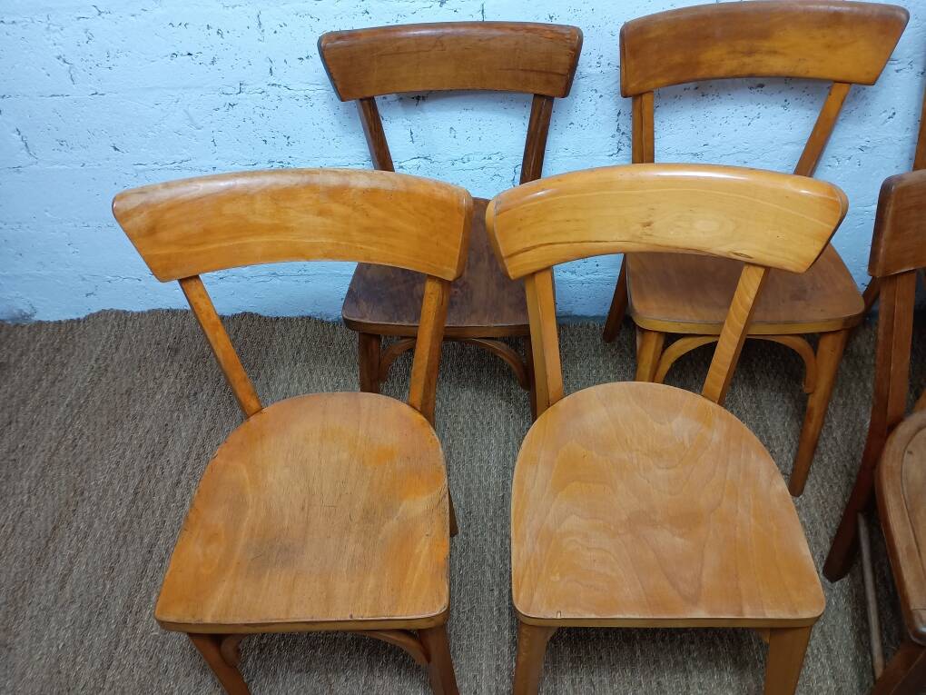 Set of 9 mismatched bistro chairs, 1950s.