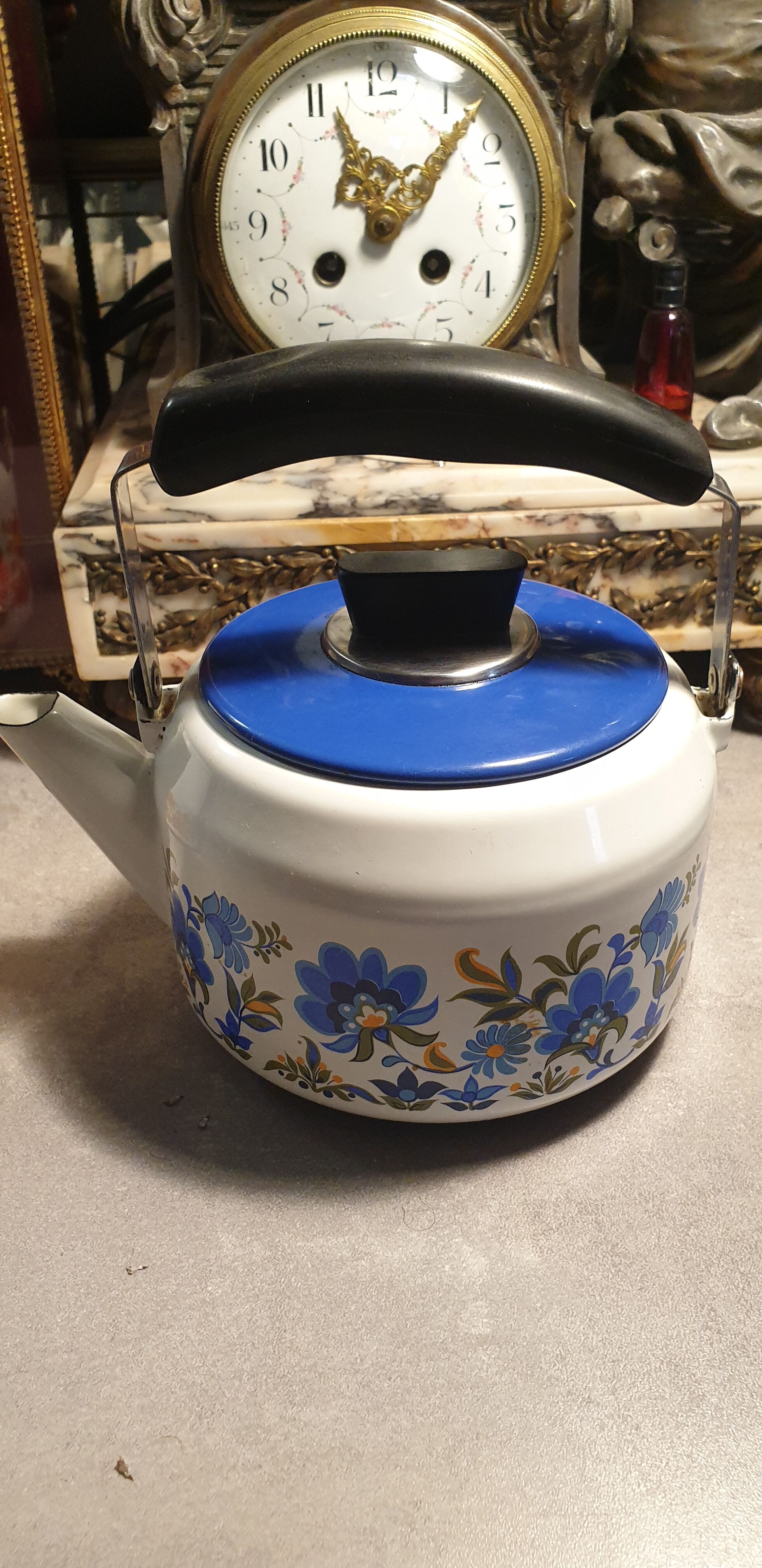 Vintage kettle in blue enamelled sheet metal