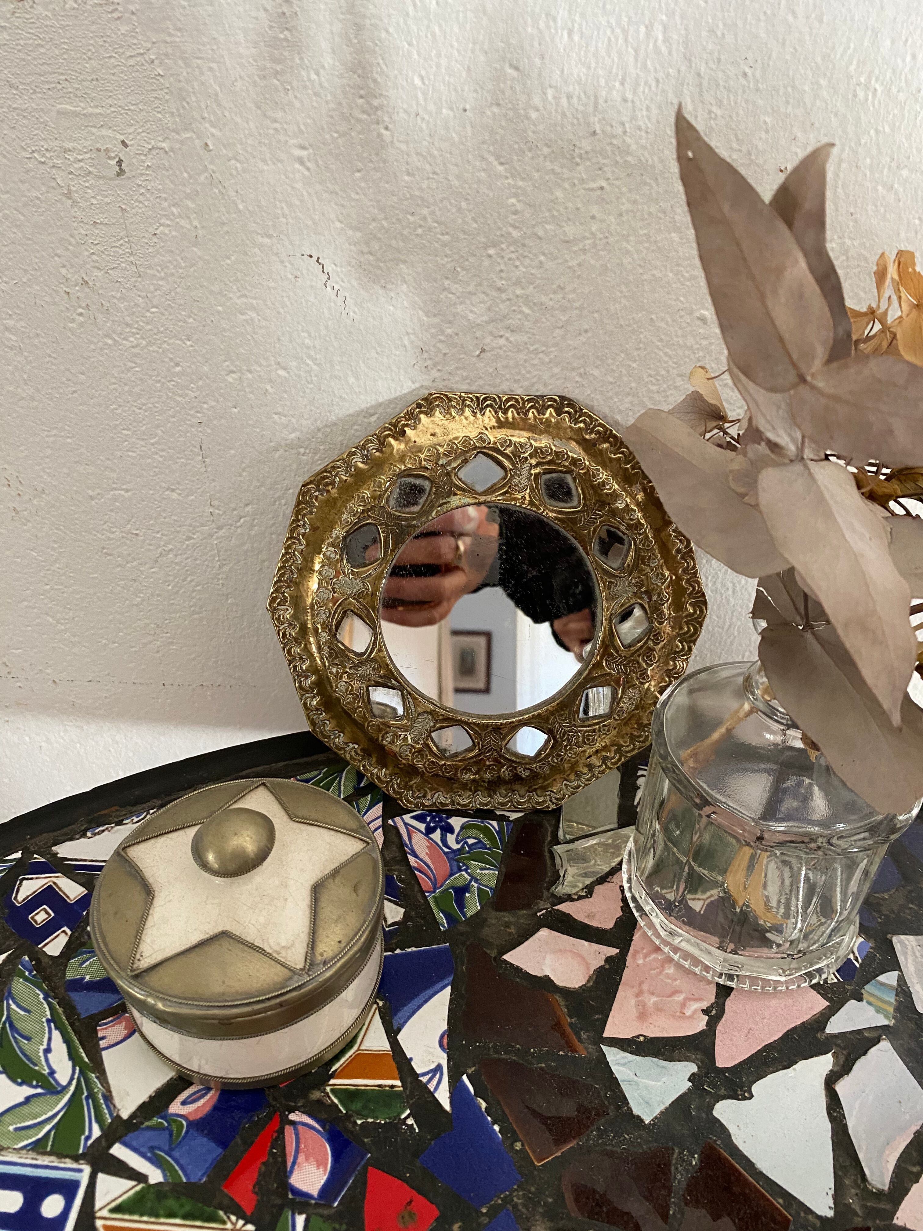 Antique mirror in worked brass