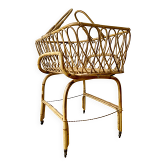 Rattan cradle on casters