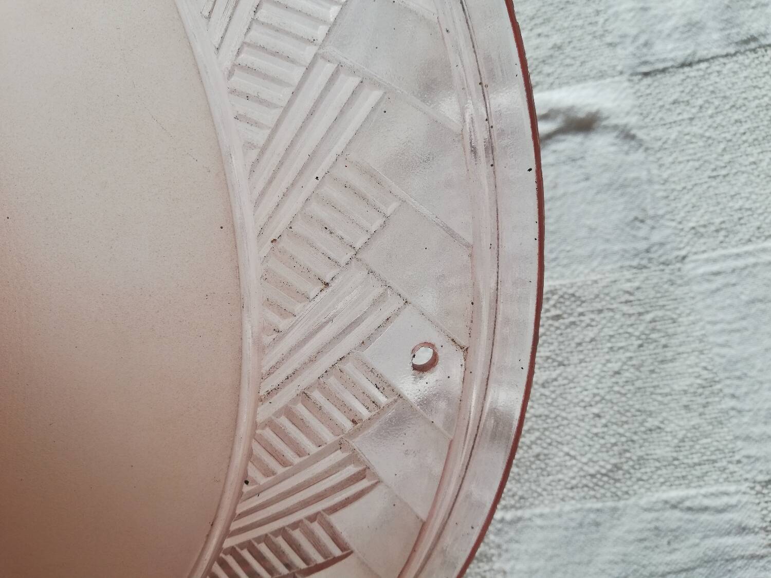 Antique ceiling light in frosted and engraved pink glass.