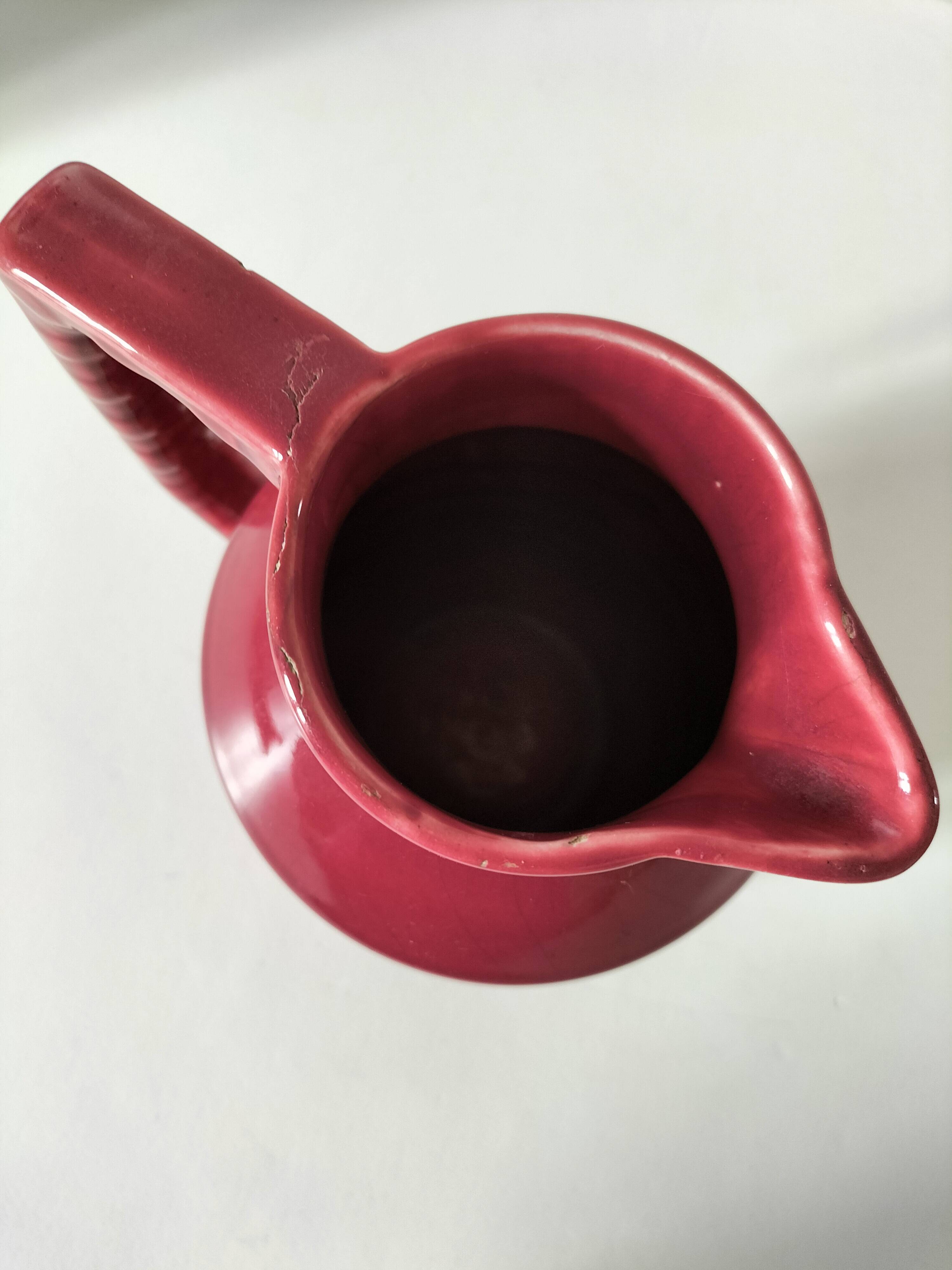 Old raspberry red pitcher from Onnaing, early 20th century.