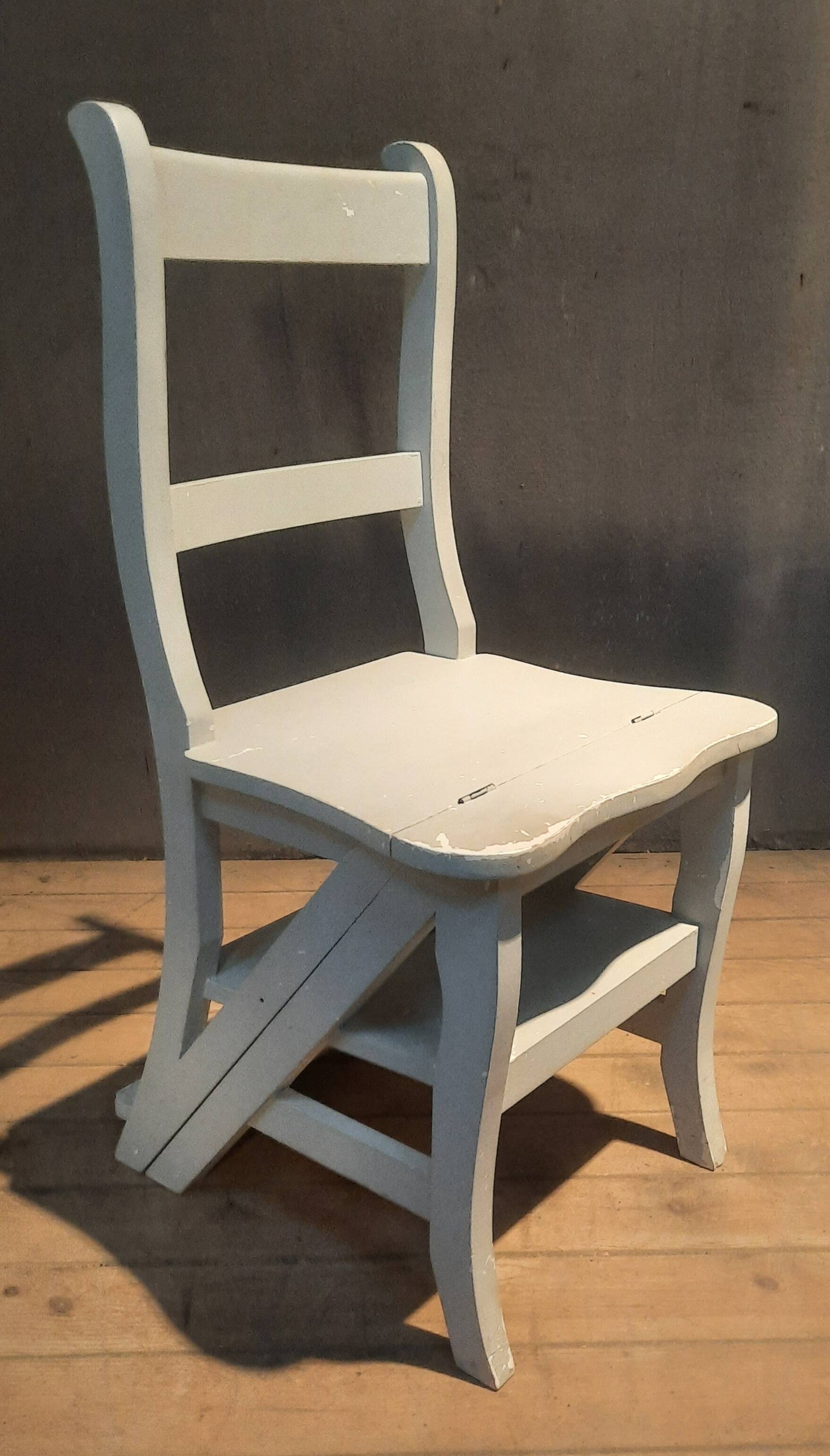White chair convertible into a staircase.