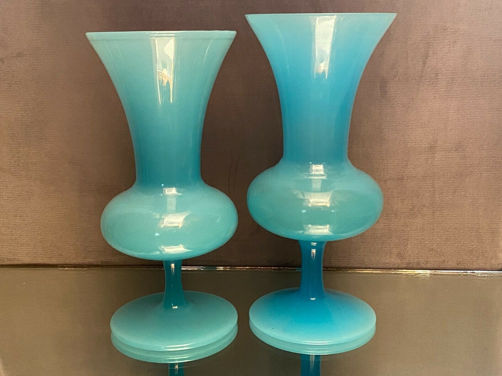 Two vases on a pedestal in blue opaline