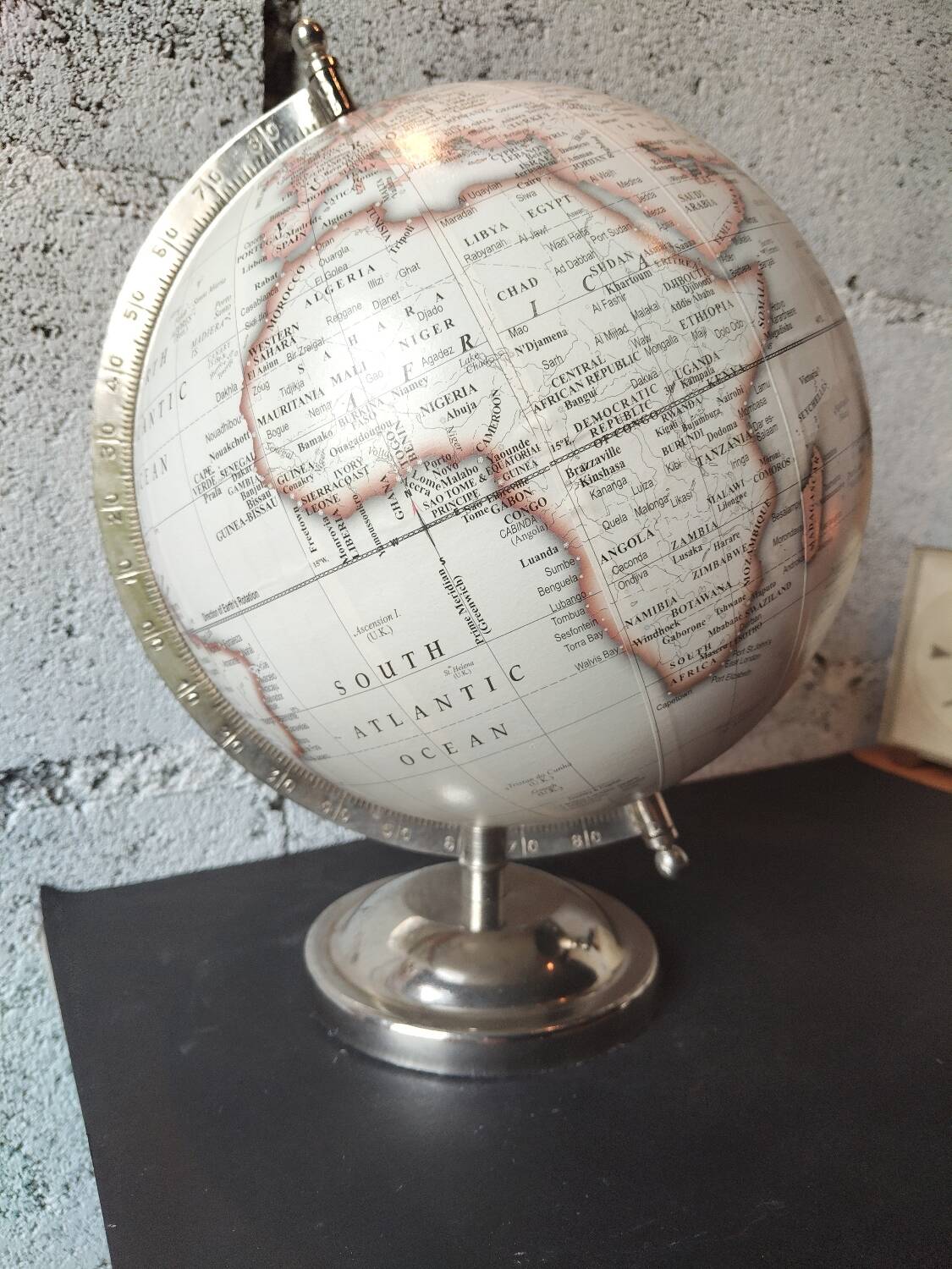 Decorative terrestrial globe on silver metal stand – explorer style