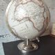 Decorative terrestrial globe on silver metal stand – explorer style