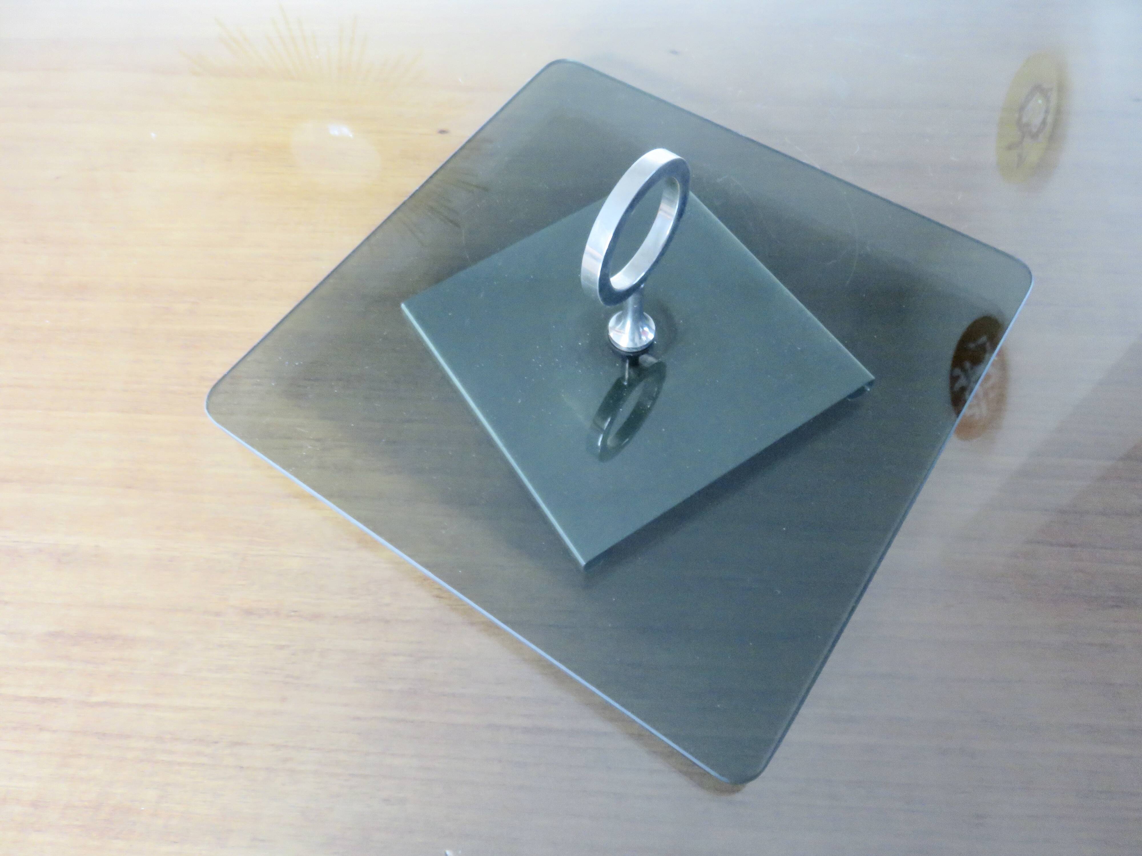 Modernist revolving serving tray, in smoked glass and silver-plated metal, 70.