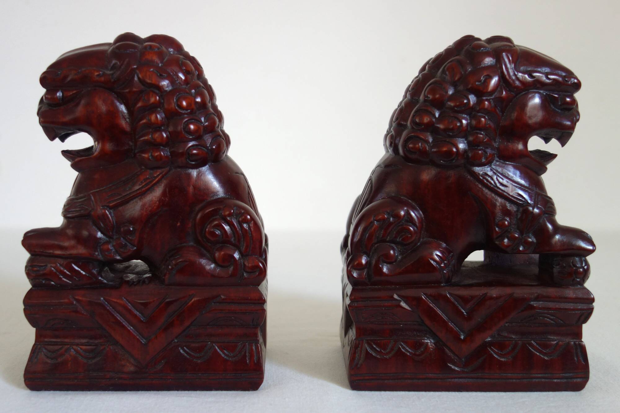 Vintage wooden pair of Foo dogs.