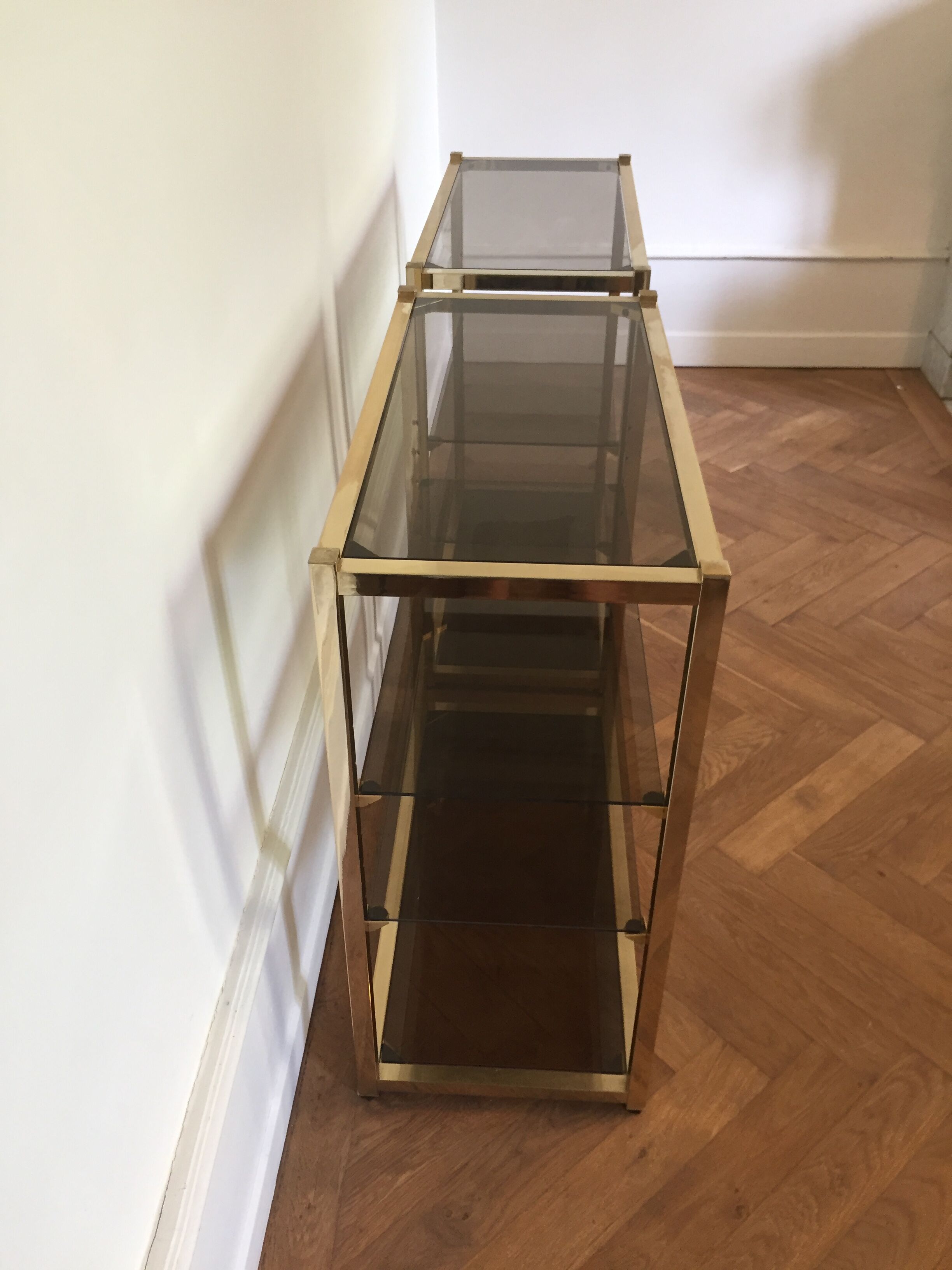 Pair of consoles brass shelves and smoked glass design Roche Bobois