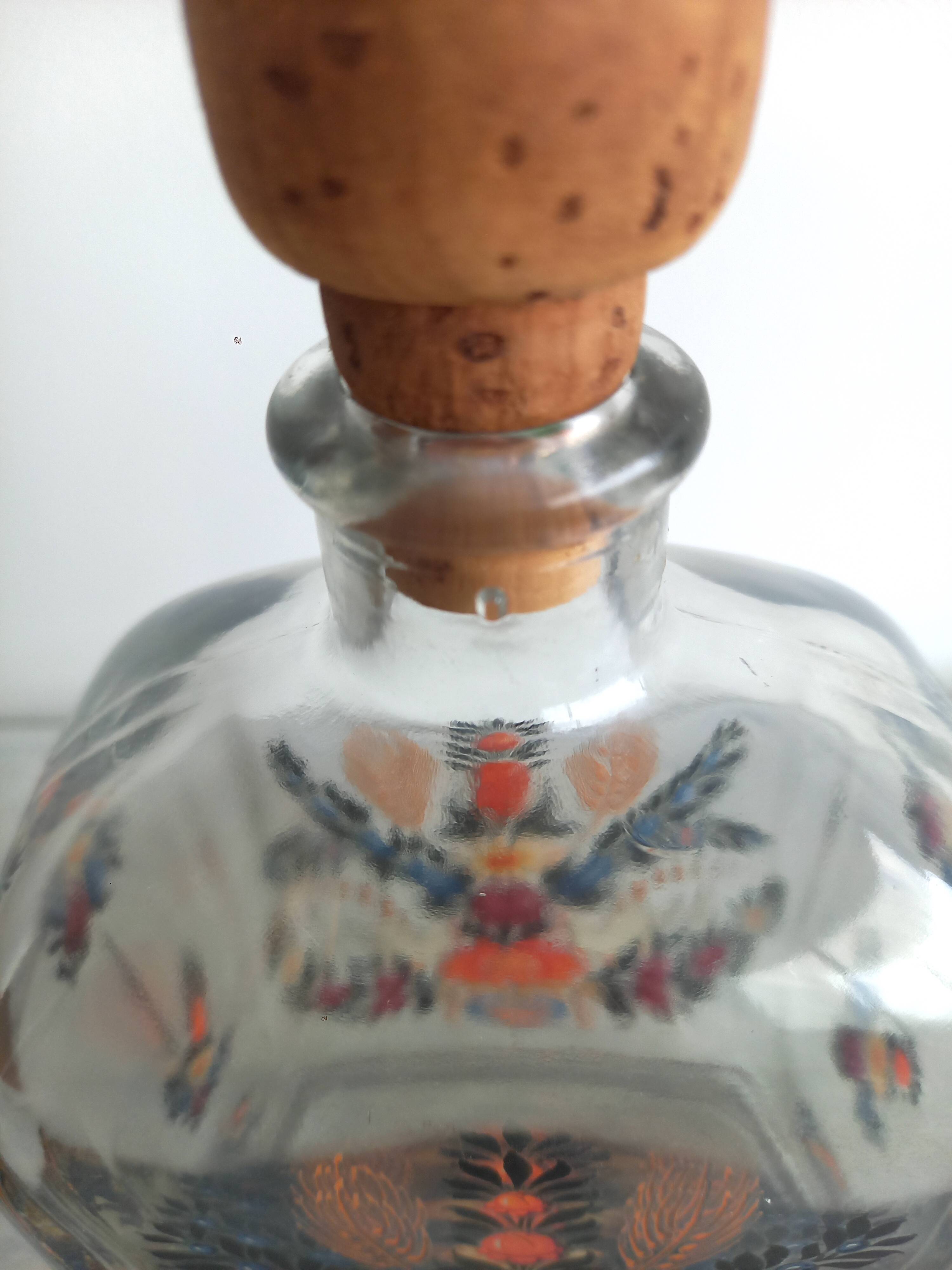 Bottle with folkloric decoration of flowers and birds inspired by Eastern countries