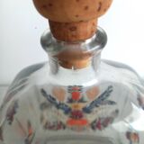Bottle with folkloric decoration of flowers and birds inspired by Eastern countries