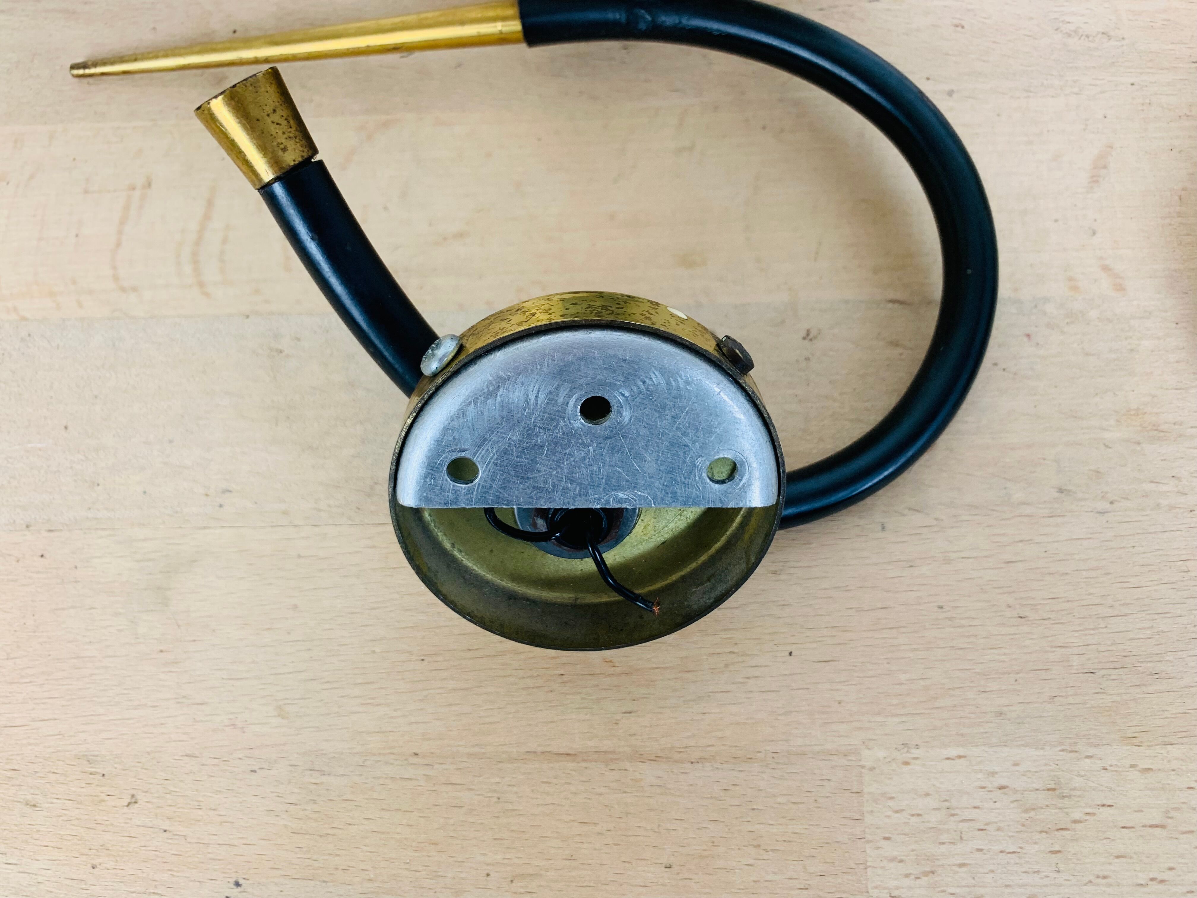 Pair of Arlus 50s opaline black and golden brass wall lamps