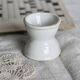Antique diabolo egg cup in white earthenware