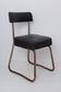 Chaise en skaï noir dossier souple