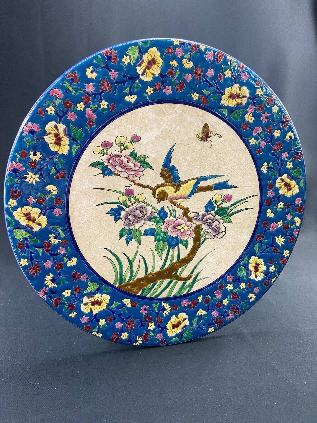 Large circular earthenware dish from Louvière with Longwy style bird decoration