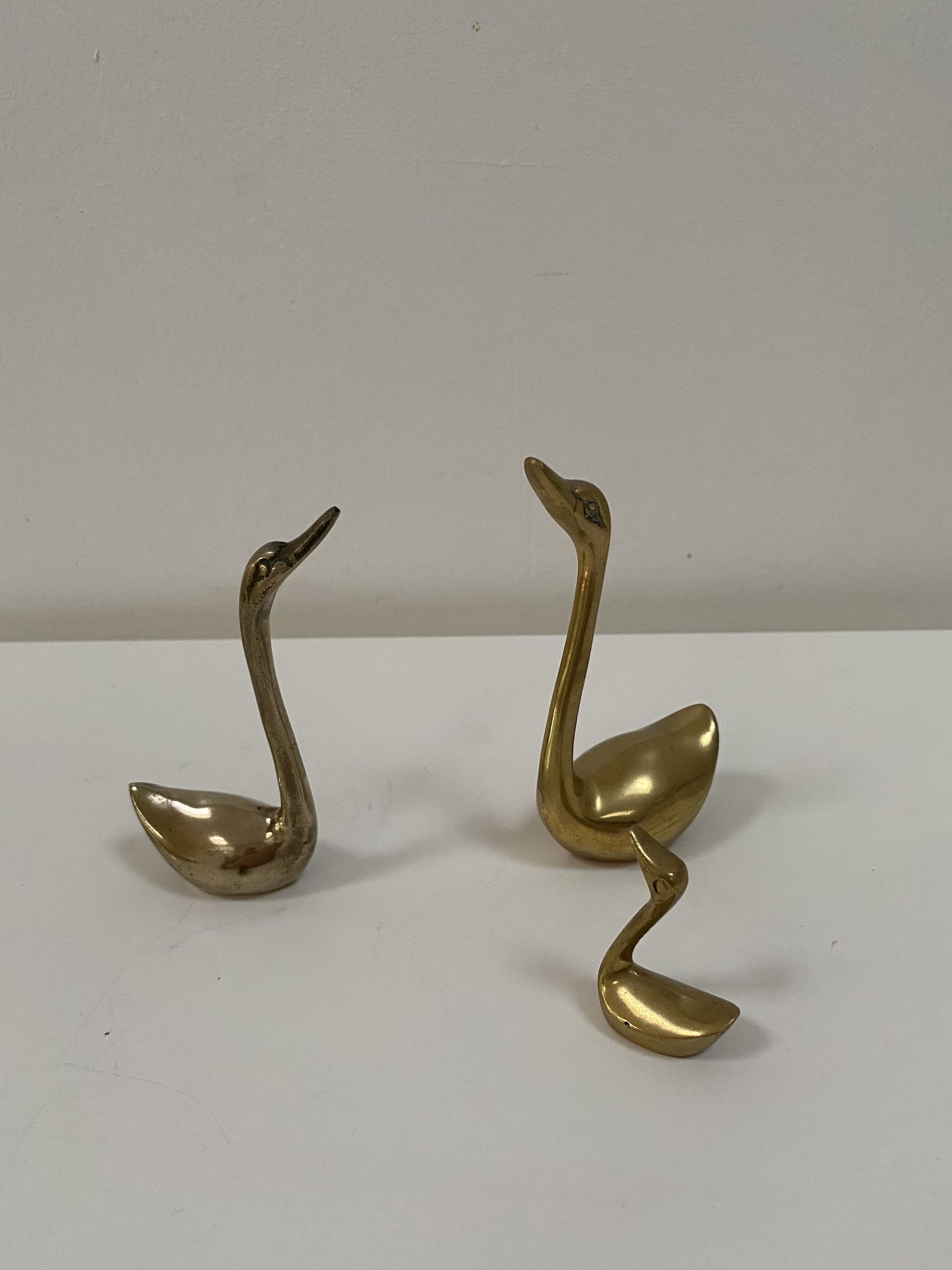 Family of brass swans of the 70s