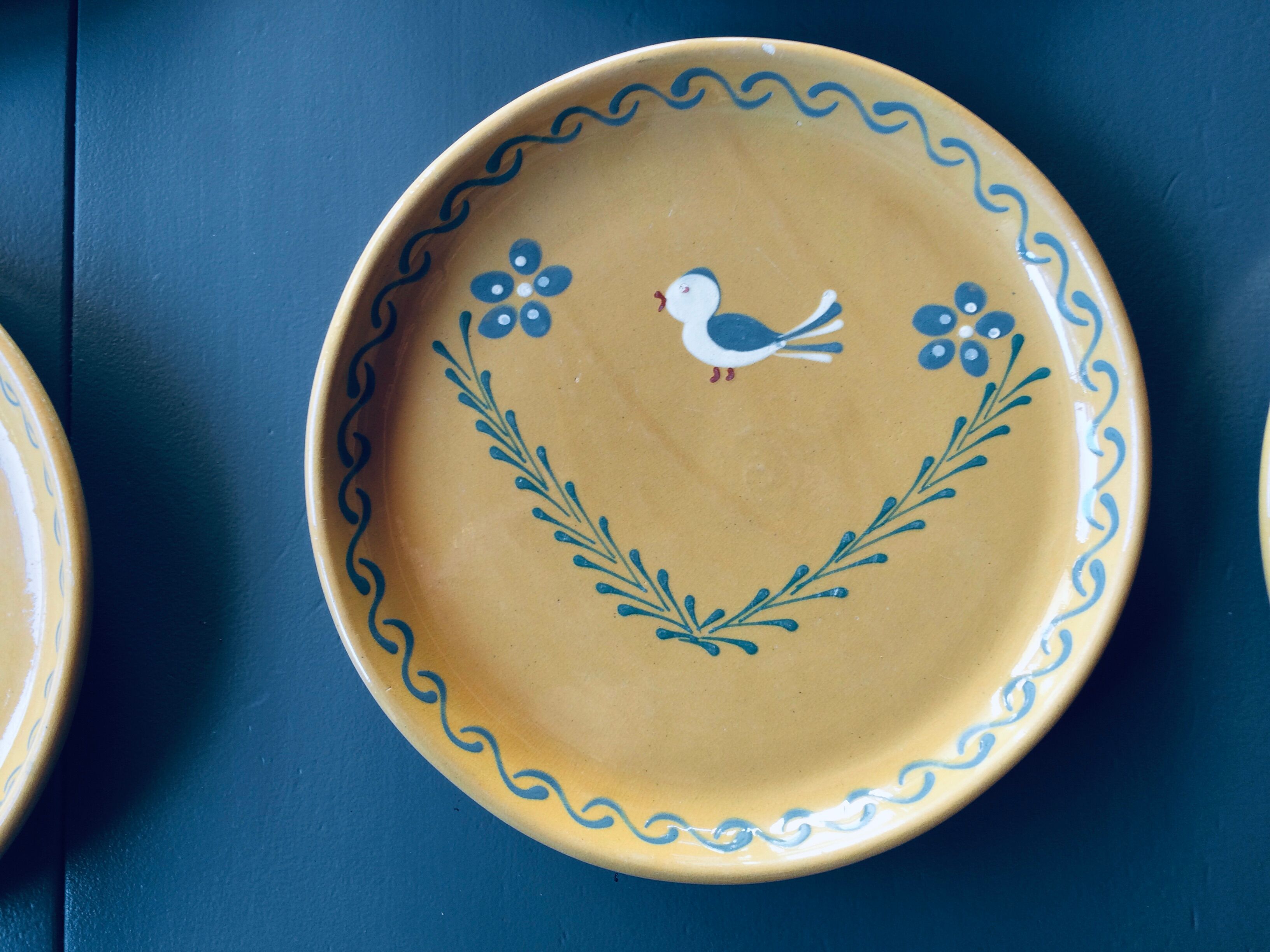 The six Piaf plates in painted terracotta
