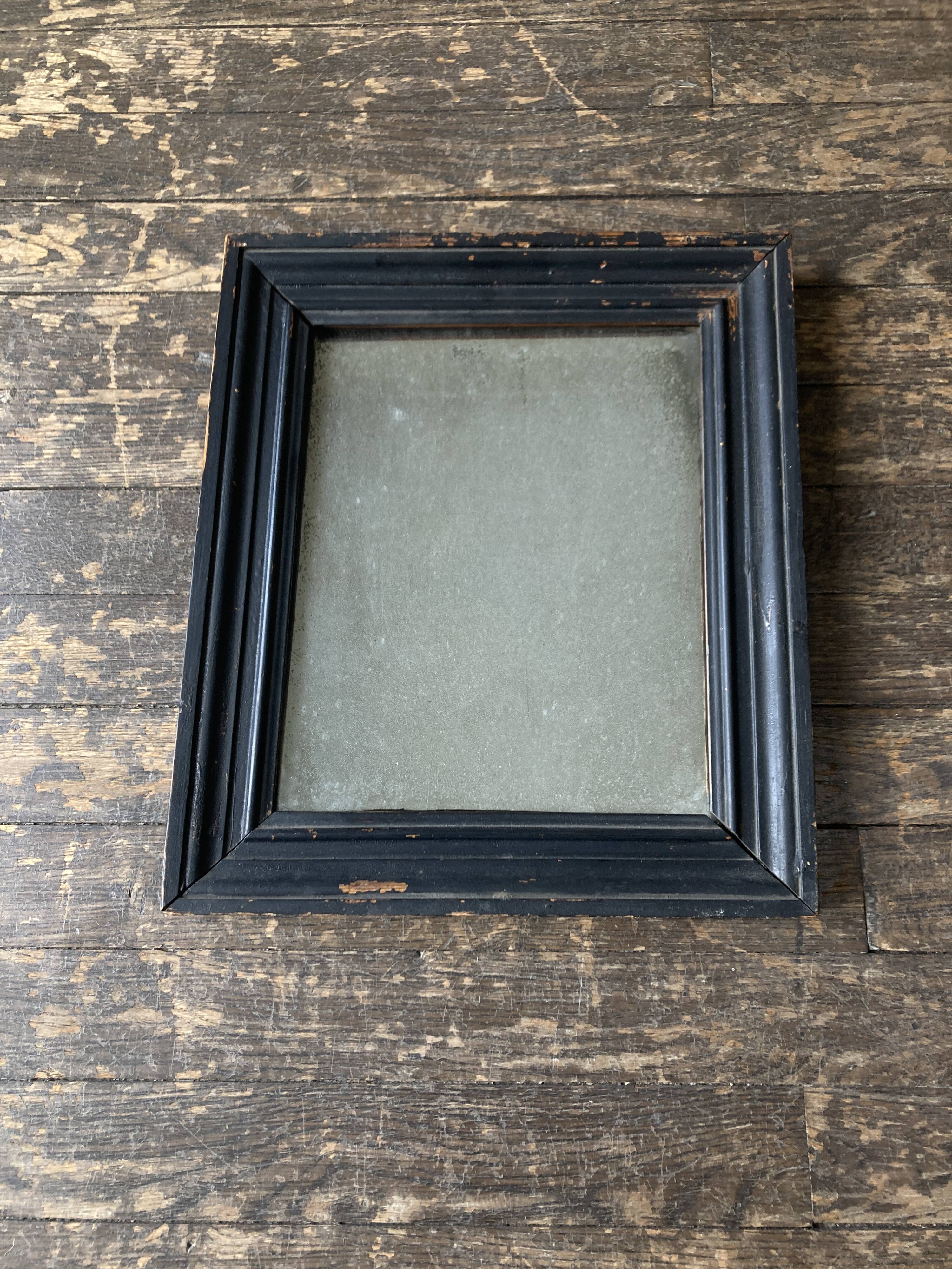 19th century blackened mirror with pitted glass 34cm x 40cm