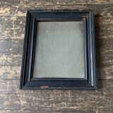 19th century blackened mirror with pitted glass 34cm x 40cm
