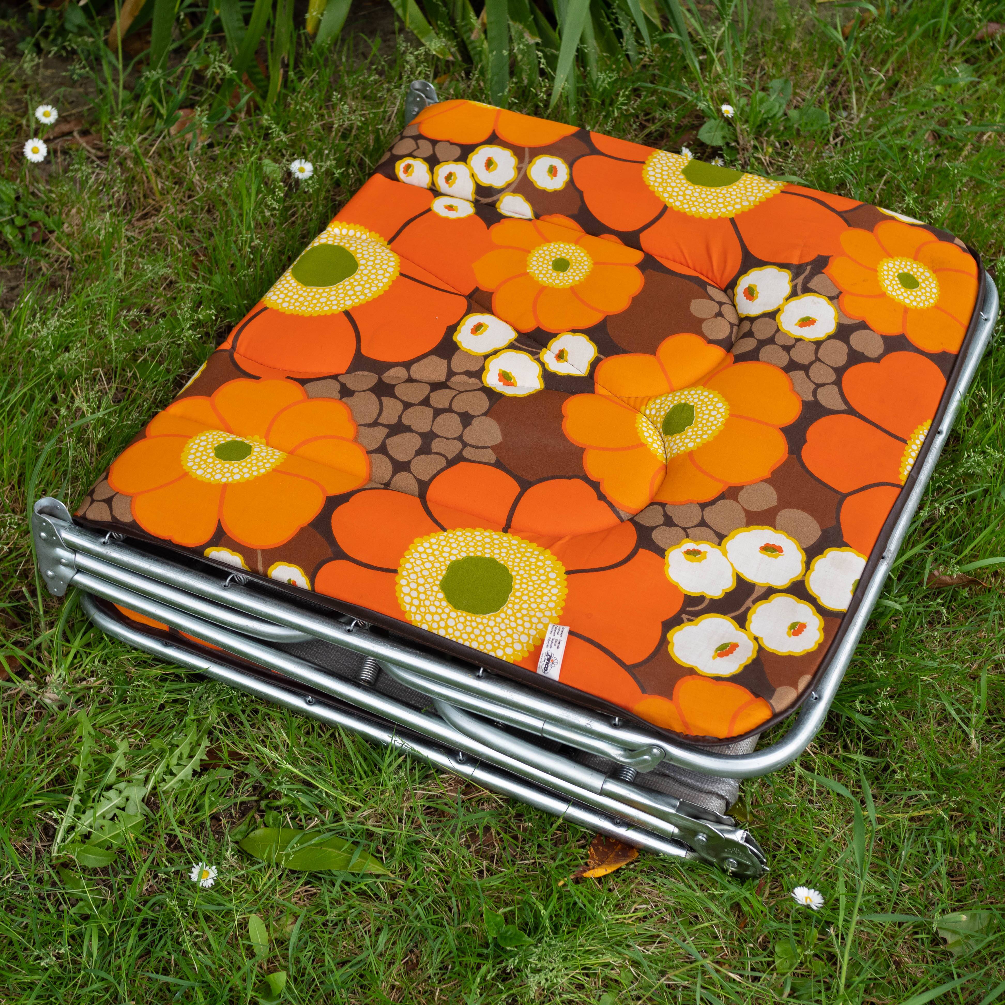 Vintage camp bed with orange flowers