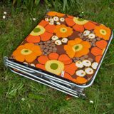 Vintage camp bed with orange flowers
