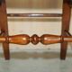 Victorian walnut dressing table chair from around 1880 with a medallion on the backrest.