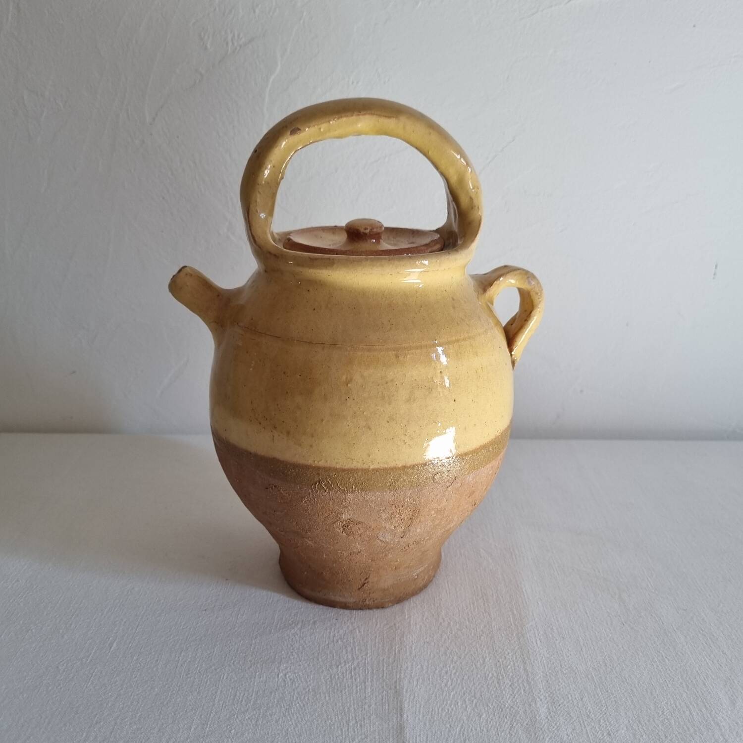 Glazed terracotta jug with lid