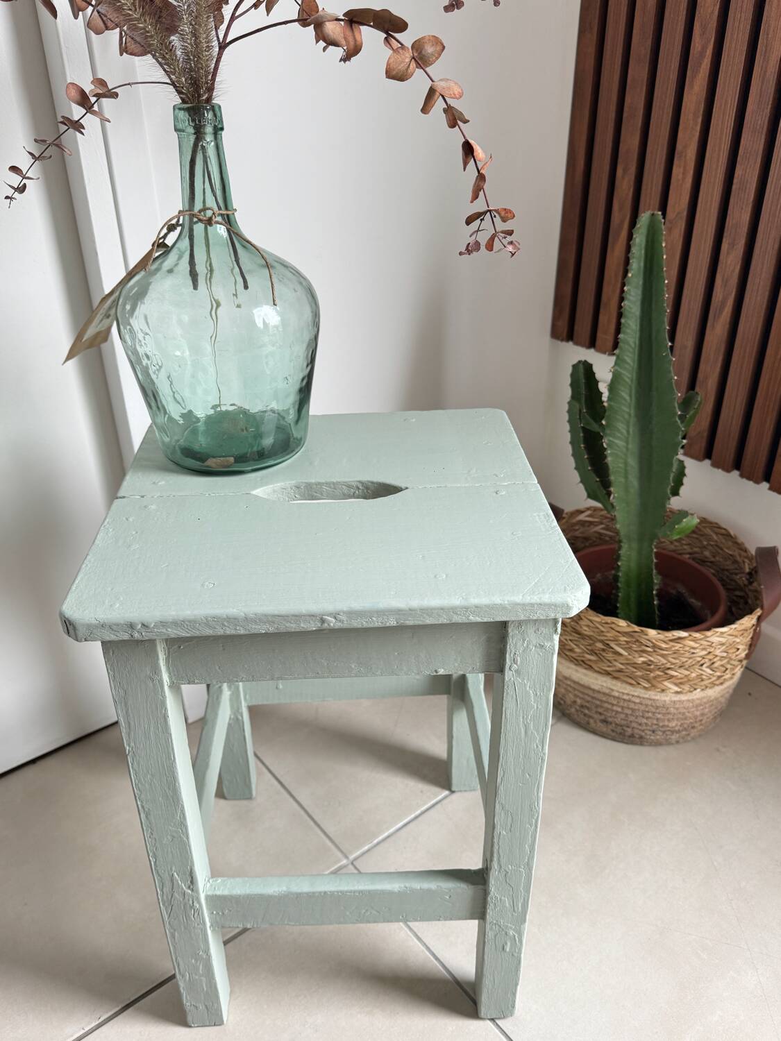 Antique almond green wooden stool