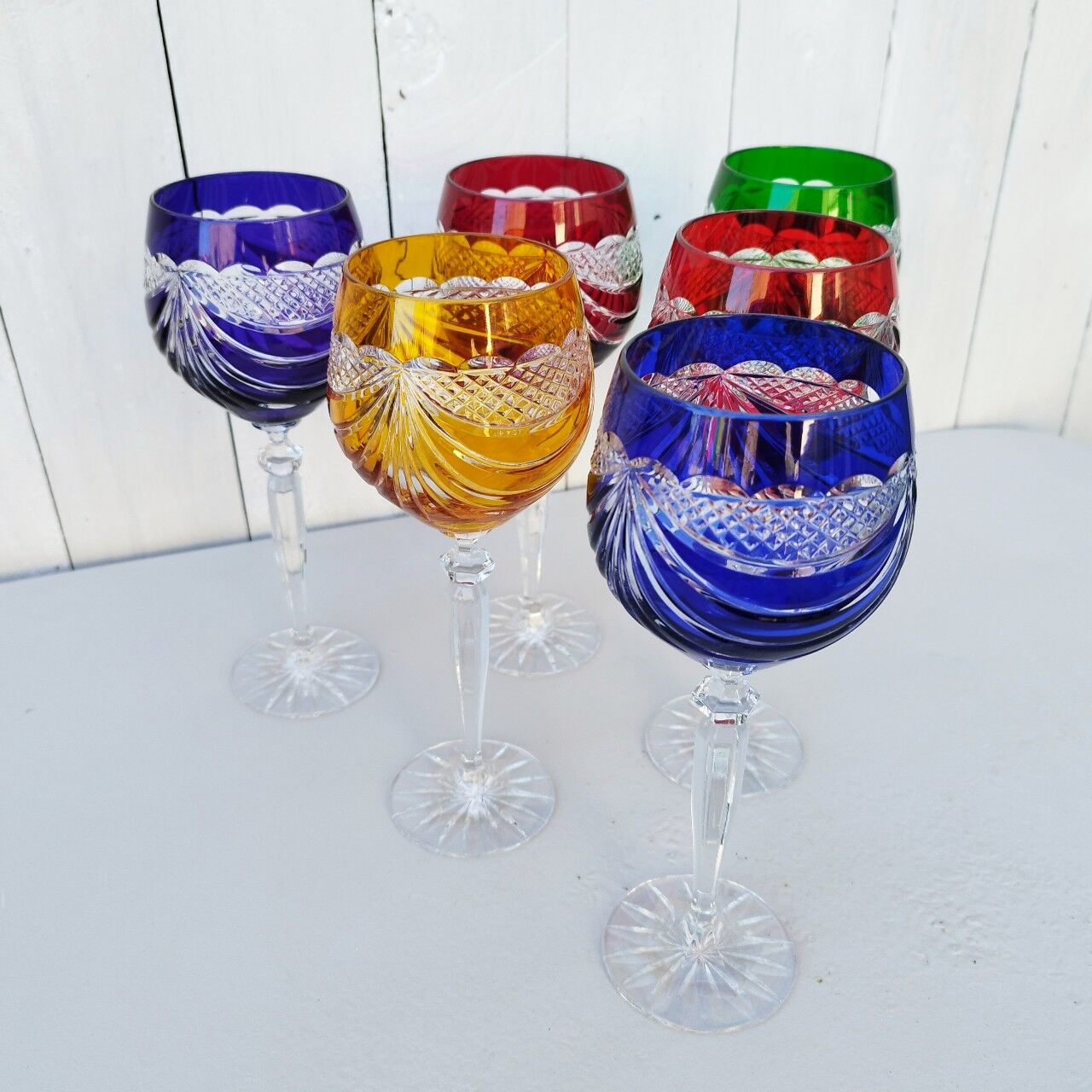 Six vintage coloured cut crystal wine glasses