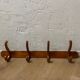 Curved wooden wall rack 4 hangers