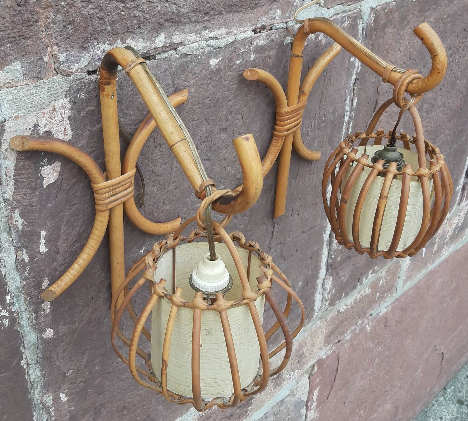 Pair of Louis Sognot rattan wall lights.