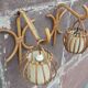 Pair of Louis Sognot rattan wall lights.