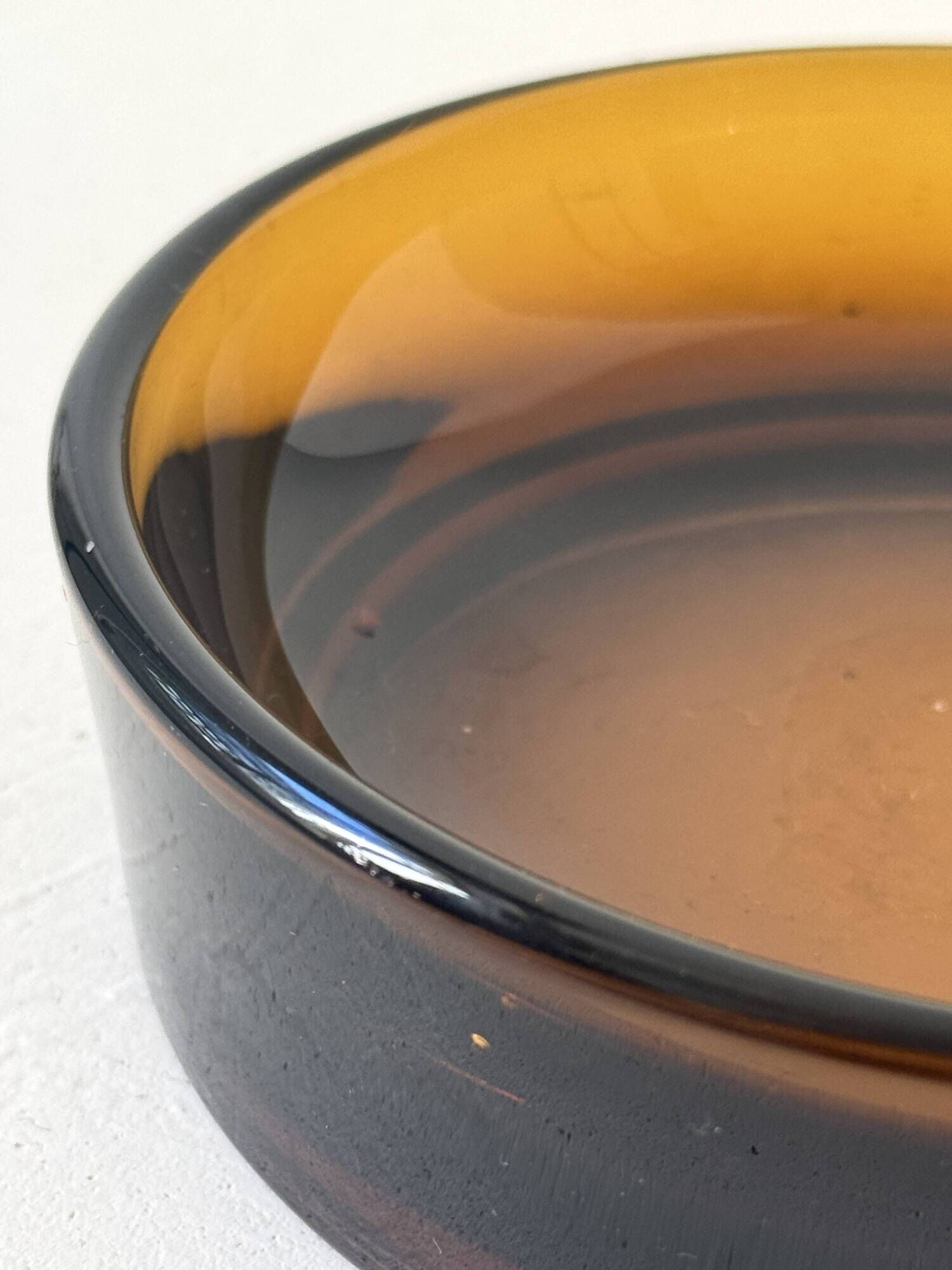 Smoked glass catchall fully tinted in amber.