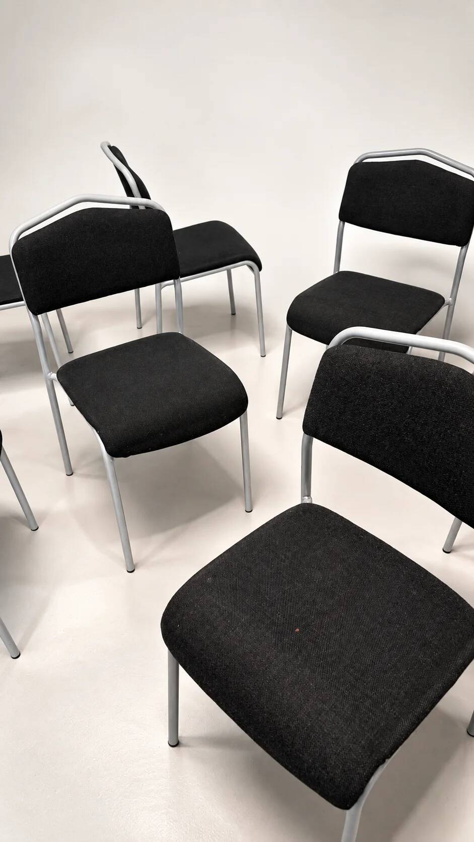 Grey steel chair and black fabric