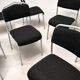 Grey steel chair and black fabric