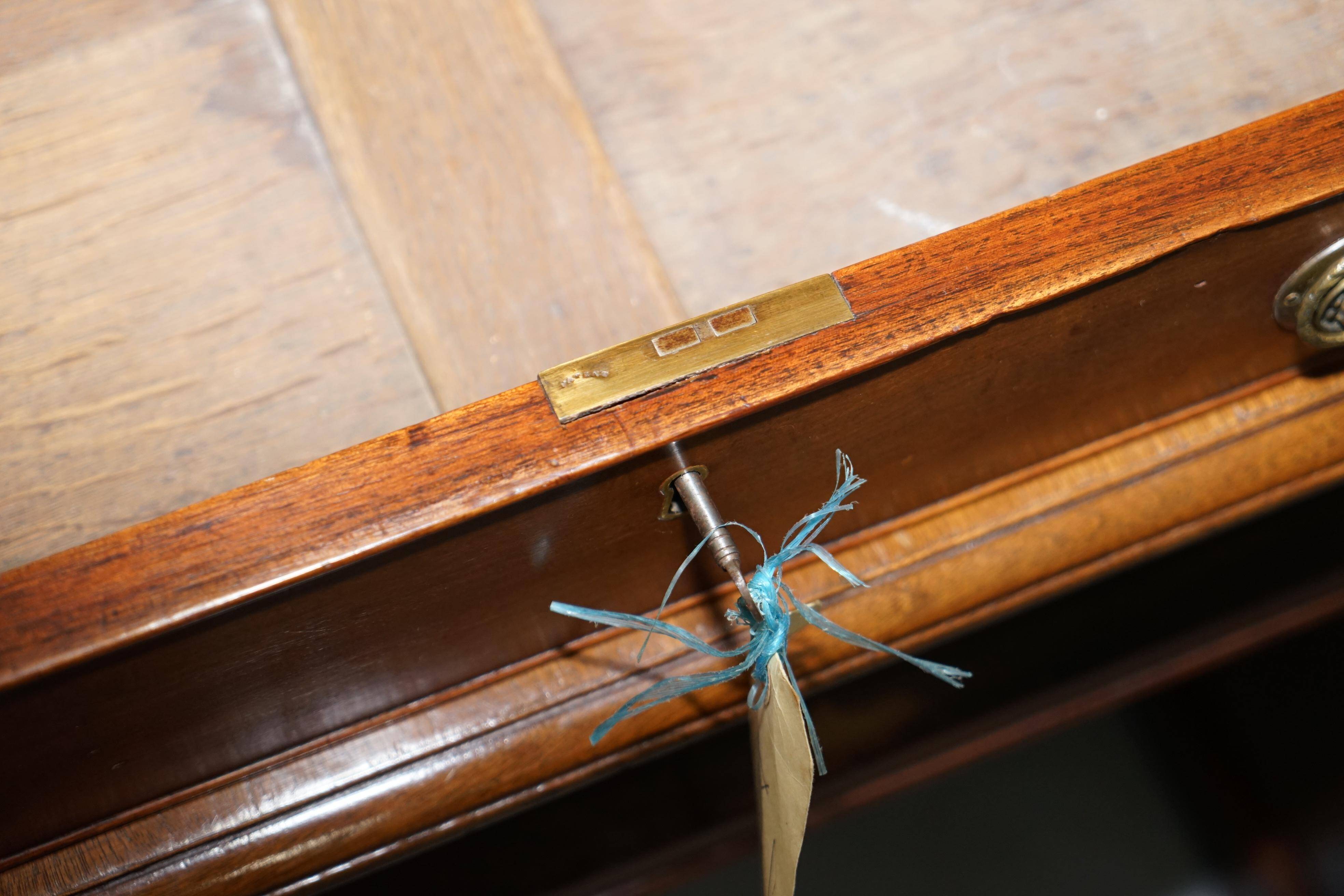 Double-sided partner's desk in walnut, George III, circa 1780, with lion head handles.