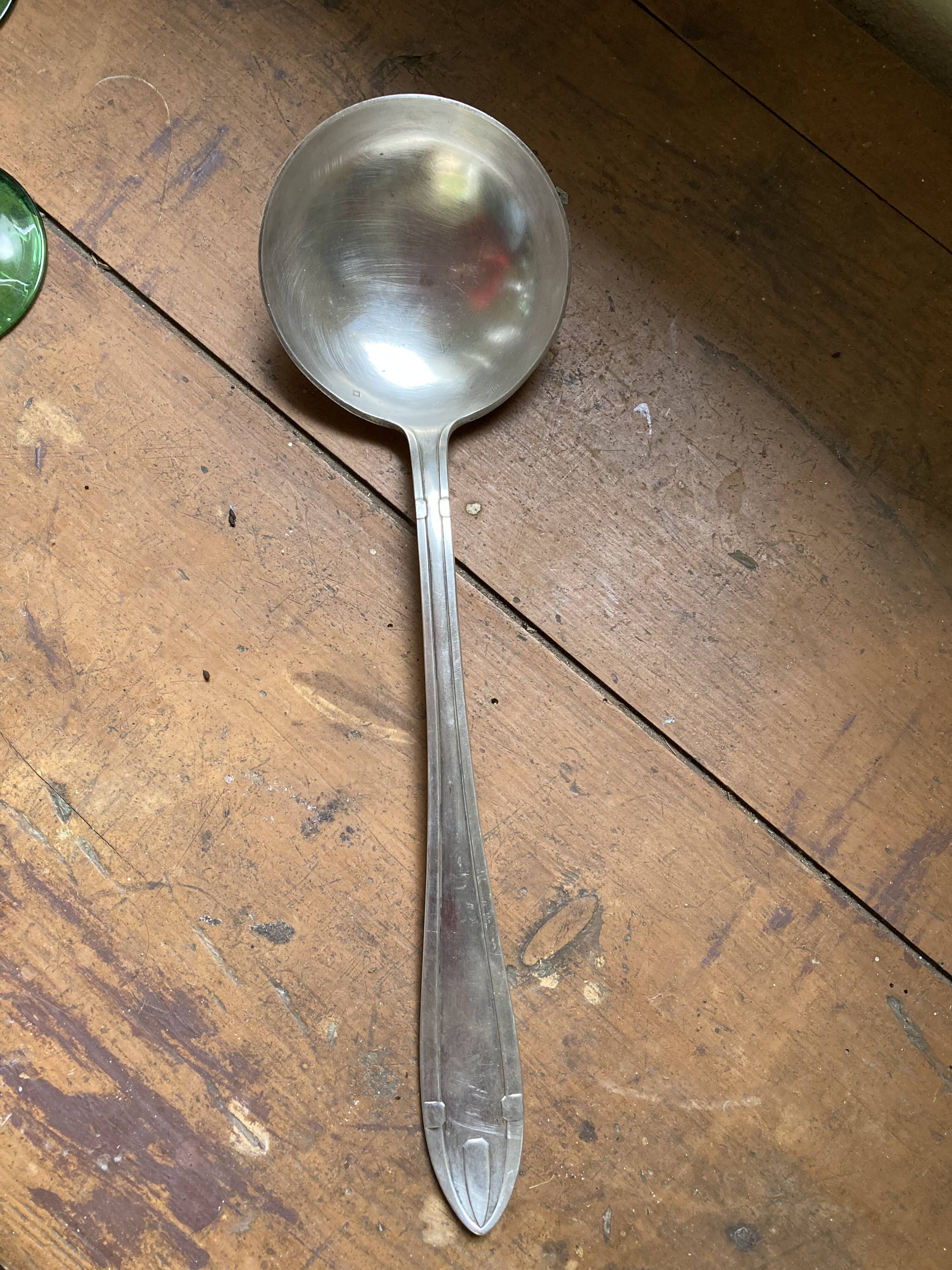 Old art deco ladle in silver metal Dixi